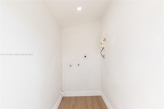 laundry area with hookup for an electric dryer, wood-type flooring, and hookup for a washing machine