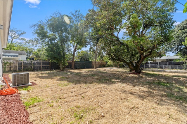 view of yard with central air condition unit