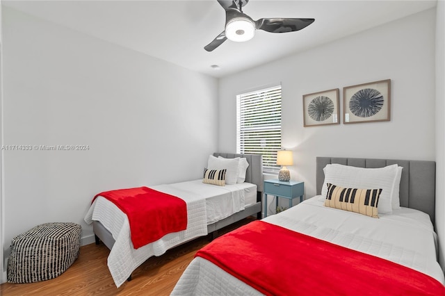 bedroom with hardwood / wood-style flooring and ceiling fan