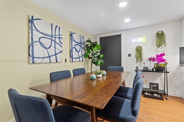 dining room with hardwood / wood-style flooring