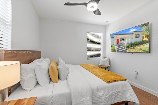 bedroom featuring ceiling fan and hardwood / wood-style flooring