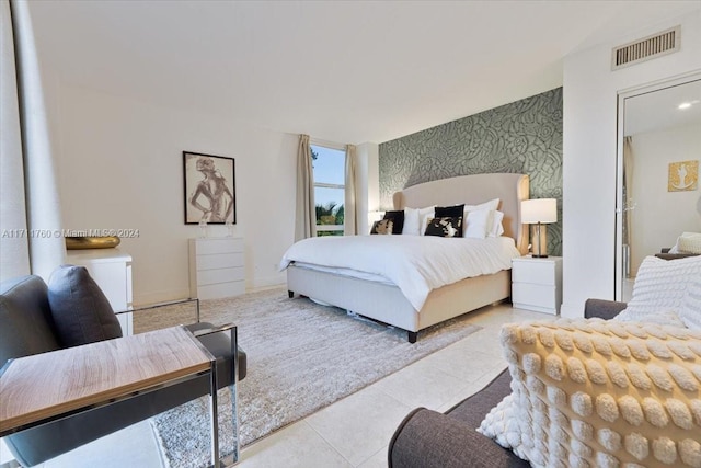 bedroom featuring light tile patterned floors