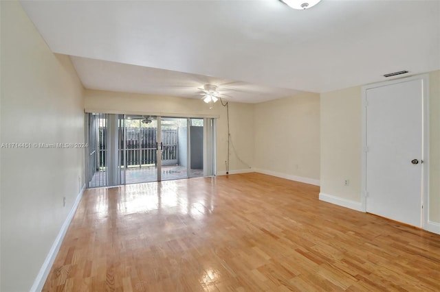 spare room featuring light wood-type flooring and ceiling fan