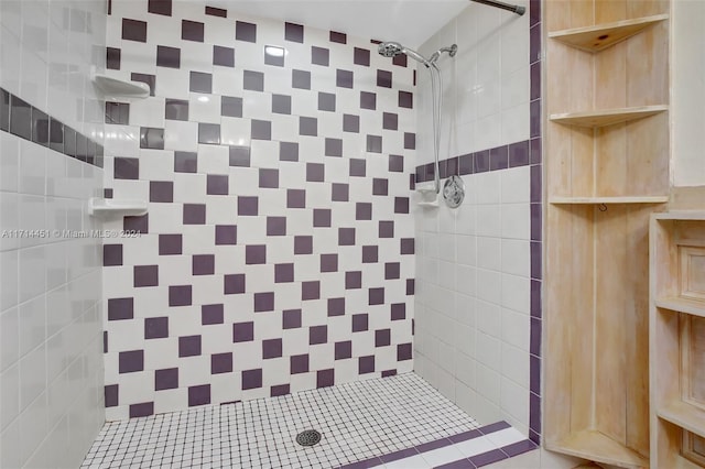 bathroom with tiled shower