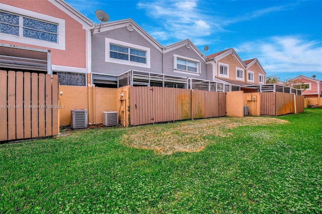 view of yard with central AC unit