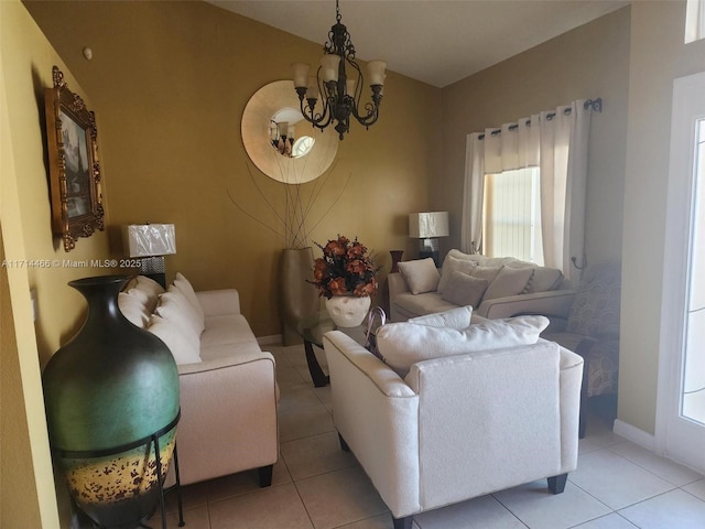 living room featuring light tile patterned flooring and a chandelier