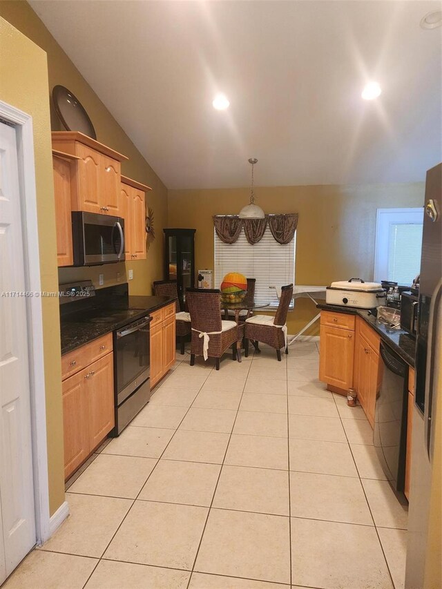 kitchen featuring light tile patterned floors, vaulted ceiling, hanging light fixtures, and black appliances