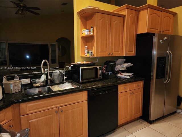 kitchen featuring sink, ceiling fan, stainless steel fridge, light tile patterned floors, and black dishwasher