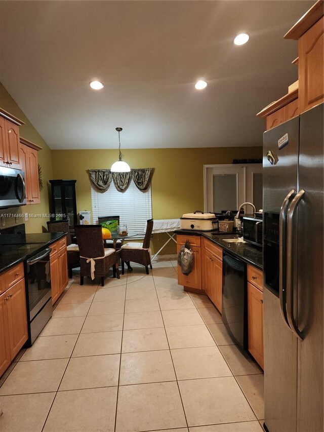 kitchen featuring pendant lighting, light tile patterned flooring, sink, and stainless steel appliances