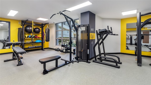 exercise room with baseboards