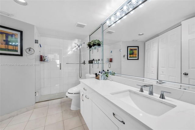 full bath with tile patterned floors, vanity, visible vents, and toilet