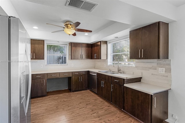 kitchen featuring ceiling fan, sink, stainless steel appliances, light hardwood / wood-style flooring, and dark brown cabinets