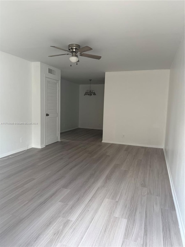 spare room with light hardwood / wood-style floors and ceiling fan