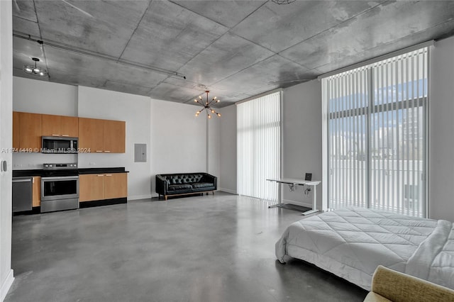 bedroom with electric panel, a chandelier, and concrete floors