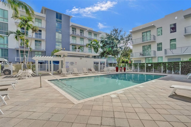 view of pool with a pergola and a patio