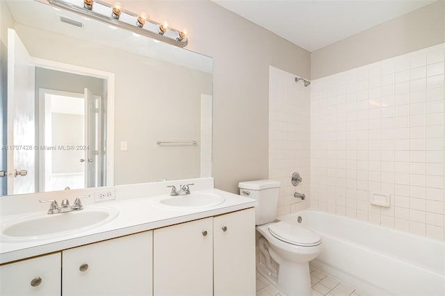 full bathroom with tile patterned floors, vanity, toilet, and tiled shower / bath