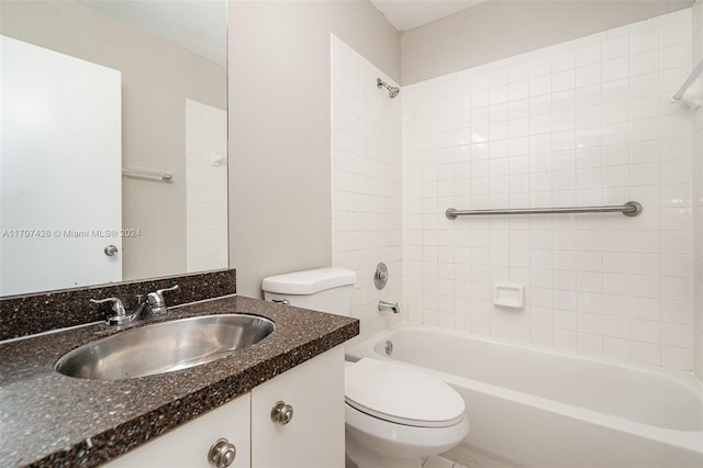 full bathroom with vanity, toilet, and tiled shower / bath combo