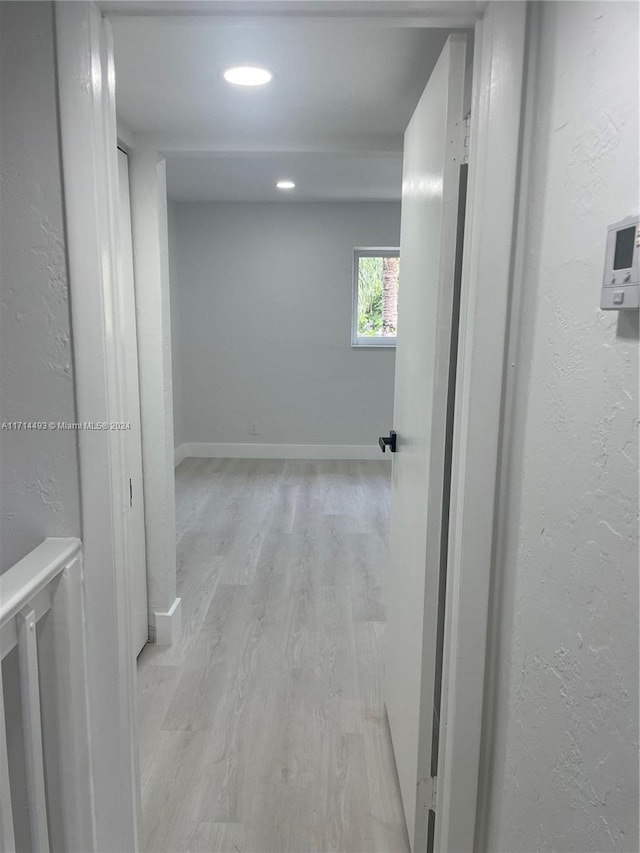 corridor featuring light hardwood / wood-style floors