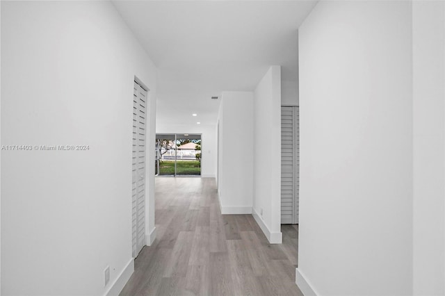 hallway featuring light wood-type flooring