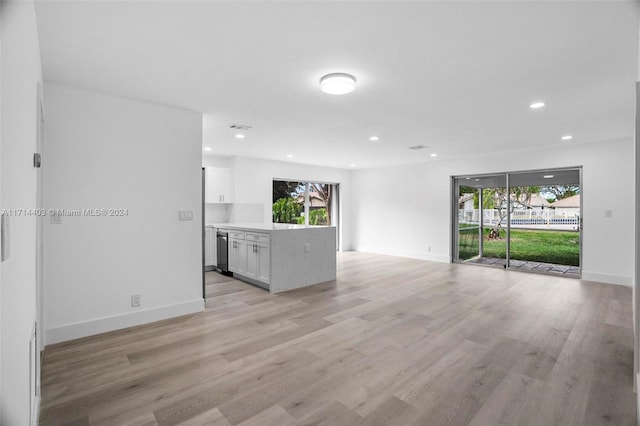 unfurnished living room with light wood-type flooring