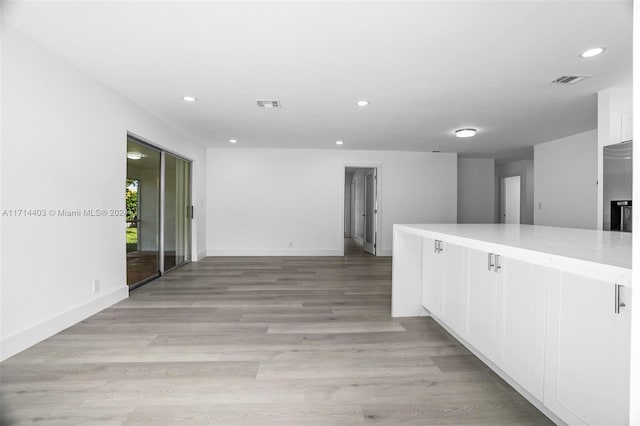 hallway featuring light wood-type flooring