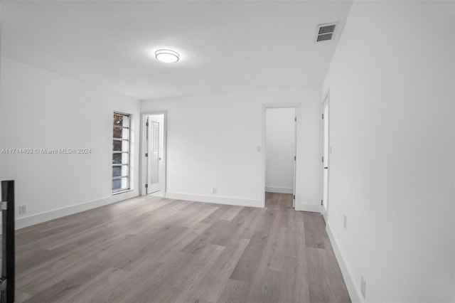 spare room featuring light wood-type flooring