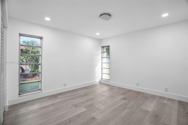 spare room featuring light wood-type flooring