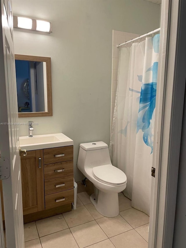 full bathroom featuring vanity, tile patterned floors, toilet, and a shower with shower curtain