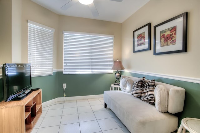 tiled living room with ceiling fan