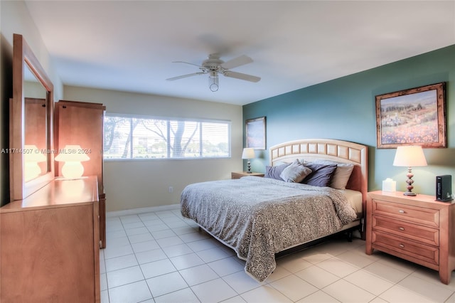 bedroom featuring light tile patterned floors and ceiling fan