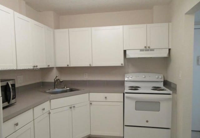 kitchen with white range with electric cooktop, white cabinetry, and sink