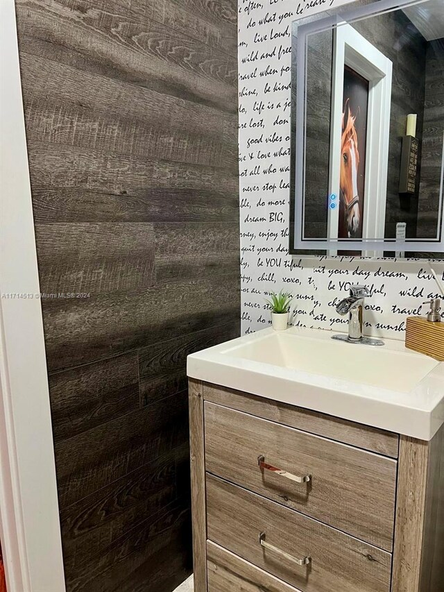 50 NW 209th St, Miami Gardens, FL 33169 - bathroom featuring wooden walls and vanity