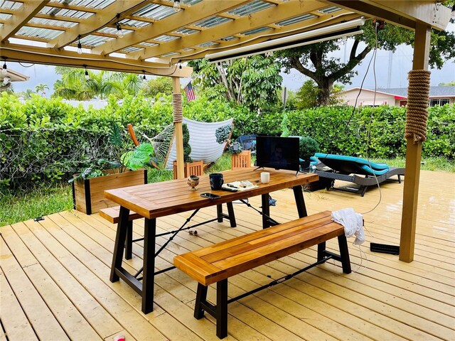50 NW 209th St, Miami Gardens, FL 33169 - wooden deck featuring a pergola and an outdoor living space