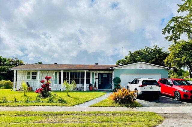 50 NW 209th St, Miami Gardens, FL 33169 - single story home featuring a front yard and a garage