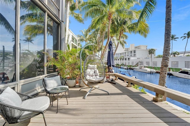 view of dock with a deck with water view