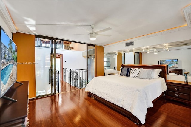 bedroom featuring floor to ceiling windows, access to outside, ceiling fan, and ornamental molding