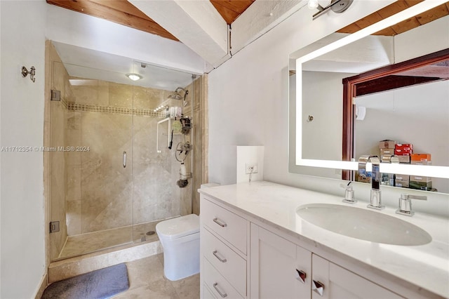 bathroom featuring tile patterned floors, vanity, toilet, and walk in shower