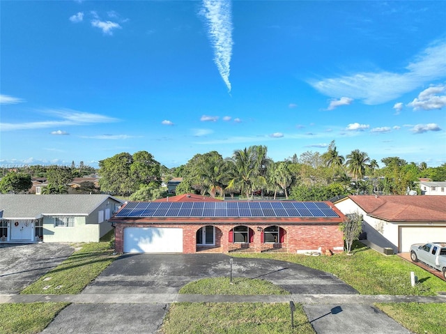 single story home with solar panels