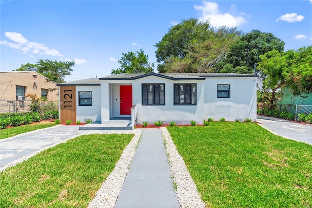 view of front of home with a front lawn