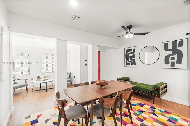 dining space featuring light hardwood / wood-style flooring and ceiling fan