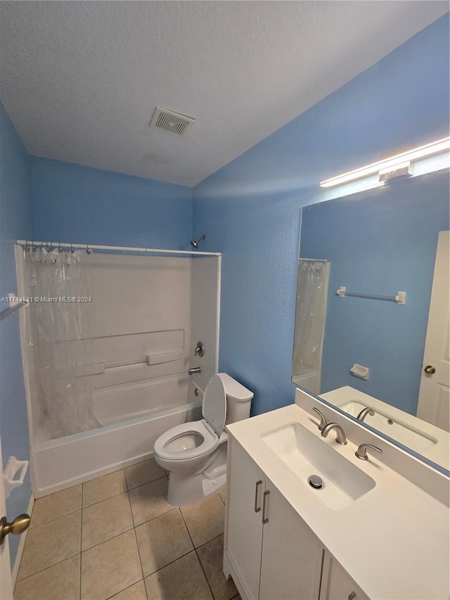 full bathroom featuring vanity, shower / bath combo, tile patterned flooring, toilet, and a textured ceiling