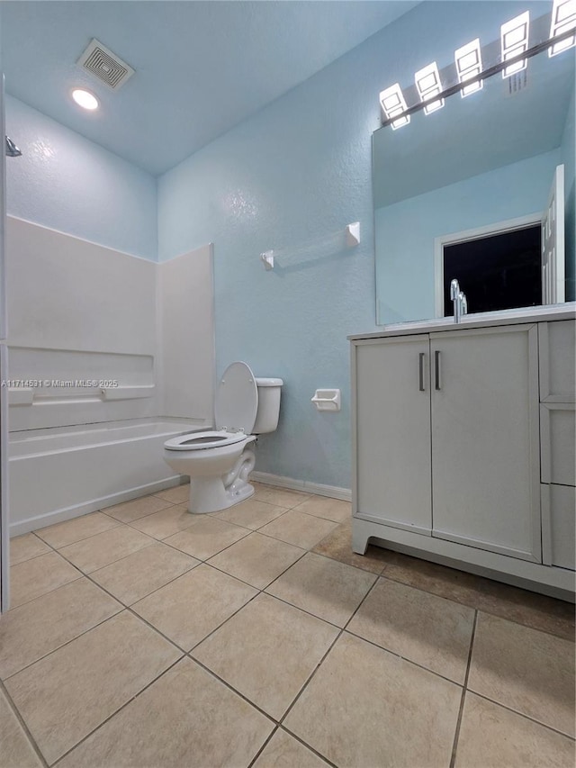 full bathroom with toilet, vanity,  shower combination, and tile patterned flooring