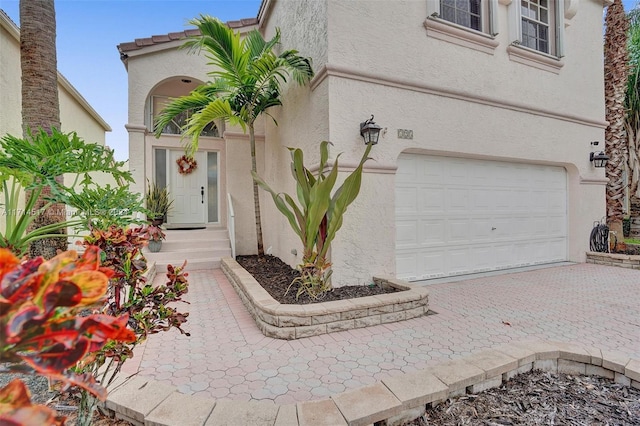 entrance to property featuring a garage