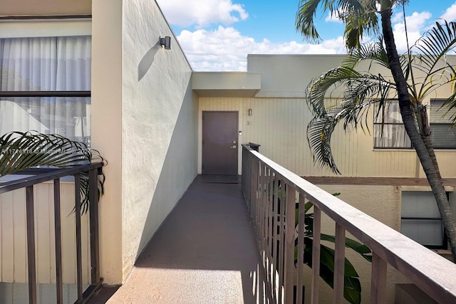 entrance to property with a balcony