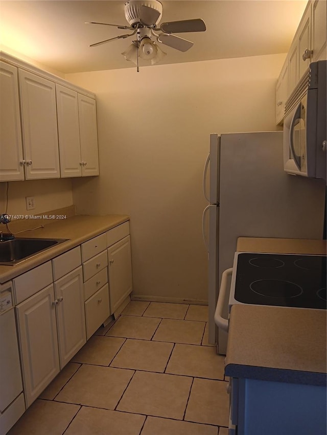 kitchen with white cabinets, dishwasher, and sink