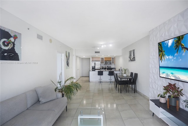 living room featuring light tile patterned floors