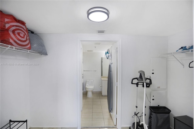 walk in closet featuring light tile patterned floors