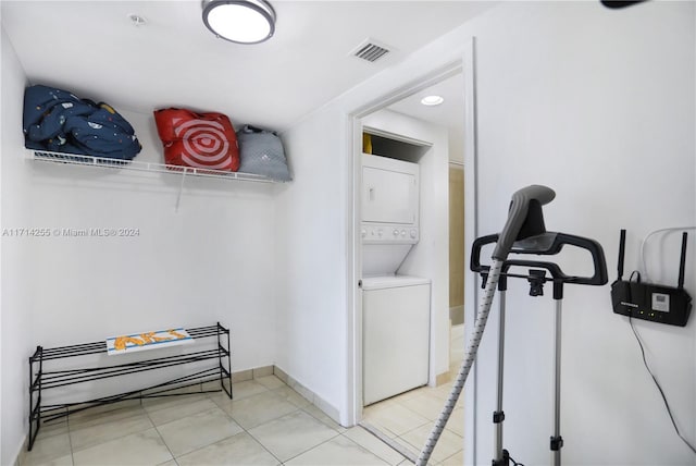 1750 N Bayshore Dr Unit 3210, Miami, FL 33132 - laundry room with stacked washer / dryer and tile patterned flooring