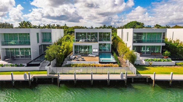 rear view of house with a water view