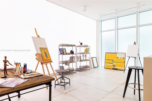 office with floor to ceiling windows and track lighting